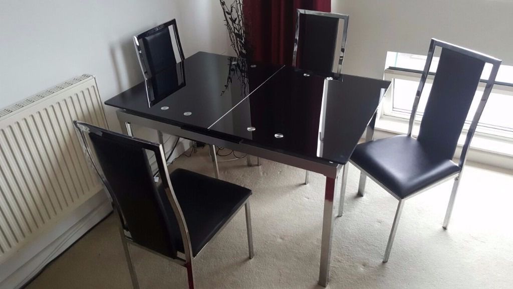 Latest Glide Extending Black Glass And Chrome Dining Table Plus 4 Atlantic In Extending Dining Tables And 4 Chairs (Gallery 19 of 20)