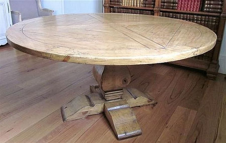 A Rustic Pine Circular Dining Table On A Stepped Pedestal Intended For Latest Rustic Honey Dining Tables (View 17 of 20)
