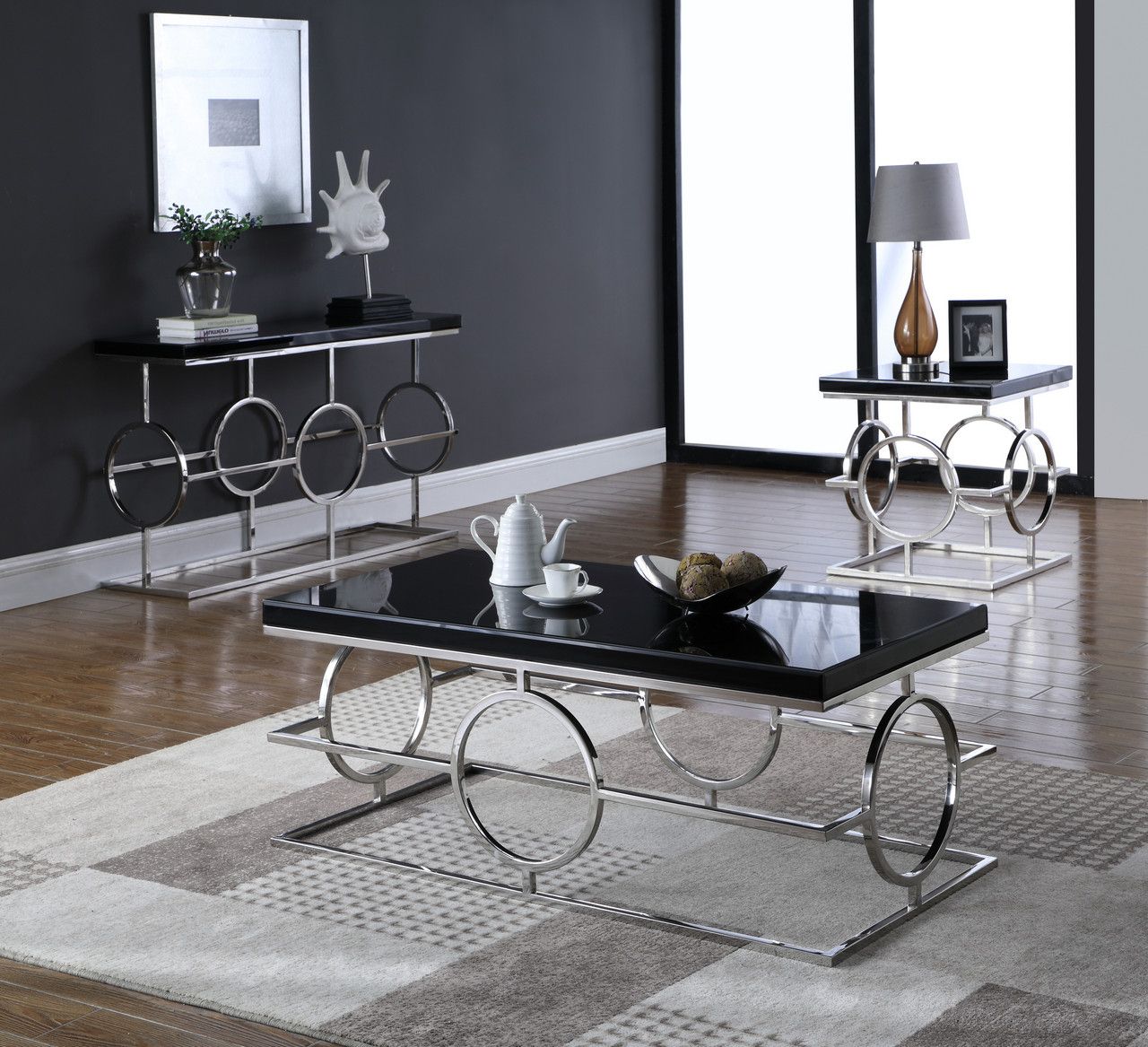 Cesario Modern Black Glass Top Coffee Table W/shaped With Regard To Recent Silver Stainless Steel Coffee Tables (Gallery 1 of 20)