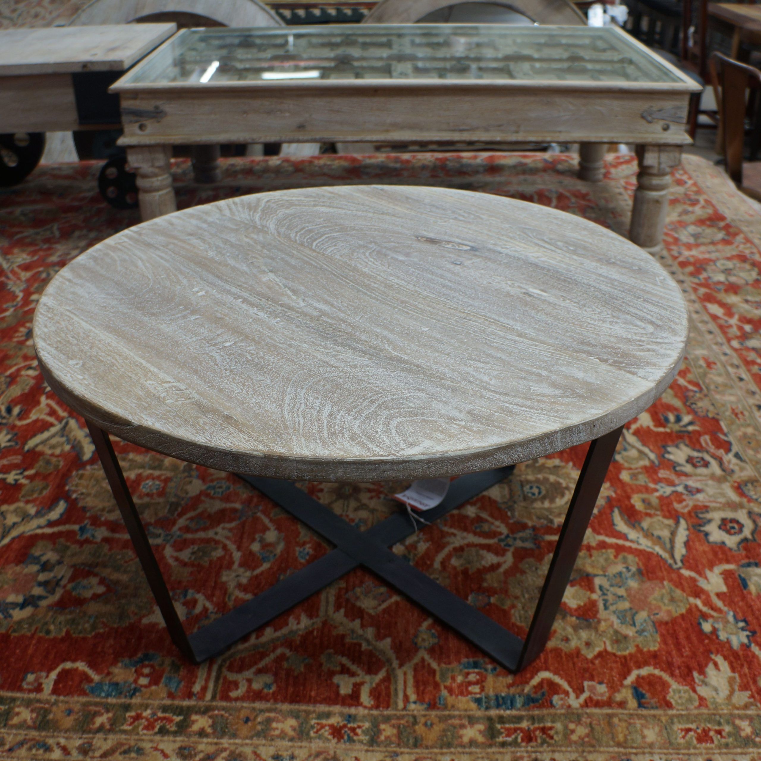 Famous Aged Black Iron Coffee Tables With Round Real Wood Coffee Table With An Black Iron Base And A (View 12 of 20)