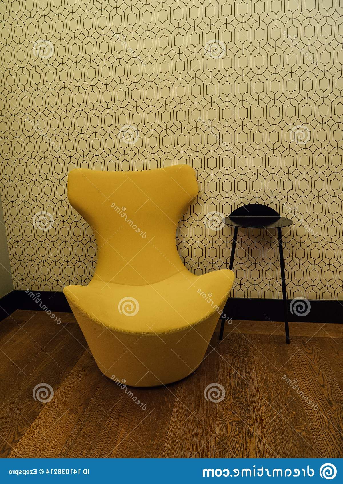 Yellow Design Sofa Next To Black Coffee Table Stock Photo Inside Well Known Yellow And Black Coffee Tables (Gallery 20 of 20)