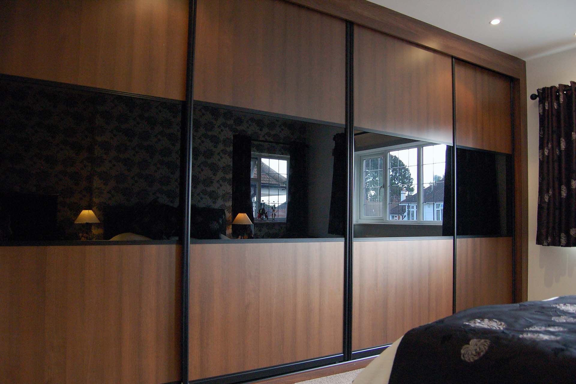 Featured Photo of 14 Best Collection of Dark Wood Wardrobes with Sliding Doors