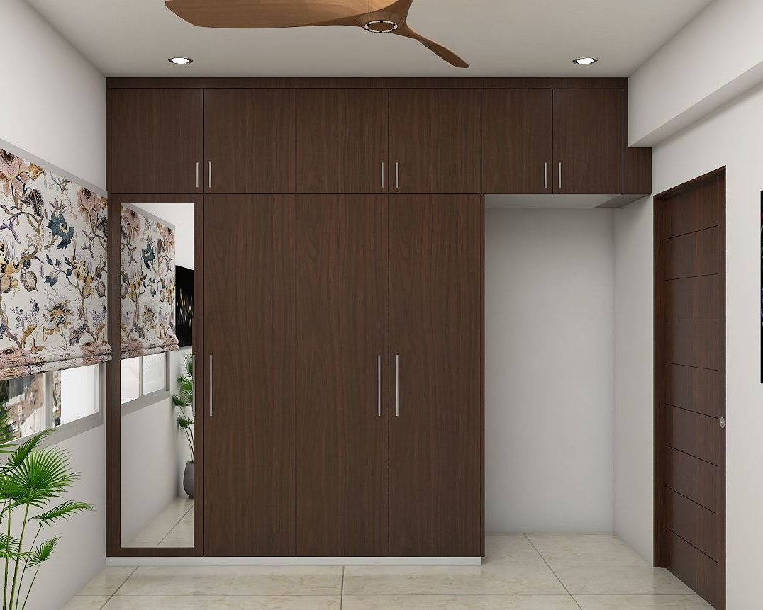 Modern Compact 4 Door Wooden Wardrobe Design With Mirror | Livspace Pertaining To Wardrobes With 4 Doors (Gallery 18 of 20)