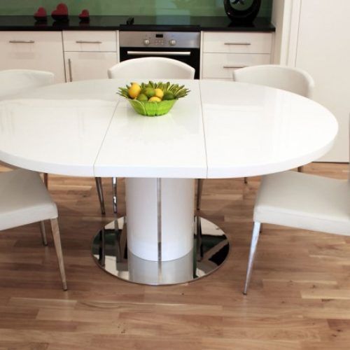 Round Dining Tables Extends To Oval (Photo 15 of 20)