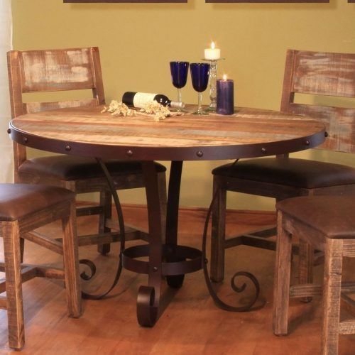 Reclaimed Teak And Cast Iron Round Dining Tables (Photo 17 of 20)