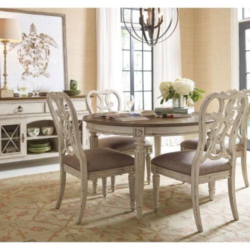 Caira Black 5 Piece Round Dining Sets With Upholstered Side Chairs (Photo 5 of 20)